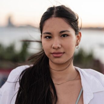 Close-Up Portrait of a Young Woman at the Beach